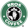 man holding a cup of coffee and smiling